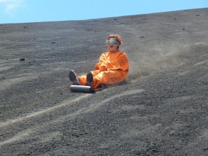 Volcano boarding in Nicaragua. Just like sledging, but really sore if you fall off. She didn't.