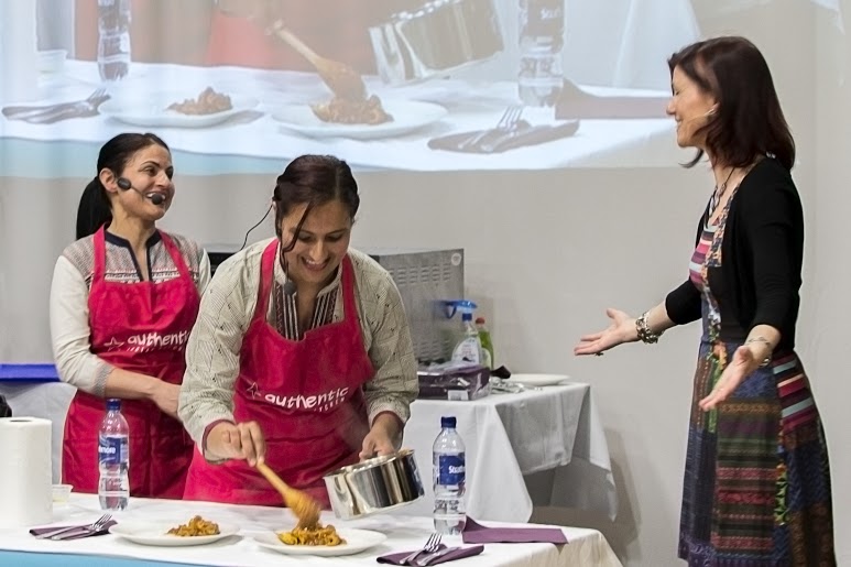 Sisters Sharan (l) and Manju from Authentic Indian Kitchen cooking at the Highland and Moray Food and Drink Festival