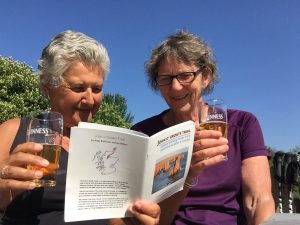 Sandra (left) and Mum-checking out the draft JOGT guidebook after Day 2, beer in hand.