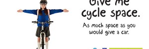 Picture of a schoolgirl on a bike with arms outstretched